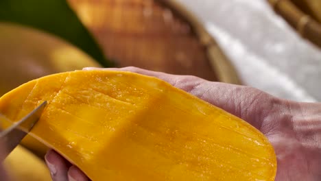 Hand-Cut-and-Carving-Ripe-Yellow-Mango,-Close-Up