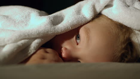 boy under the towel