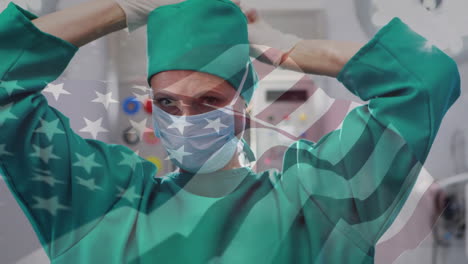 animación de agitar la bandera de los estados unidos sobre una cirujana caucásica que lleva una máscara quirúrgica en el hospital