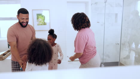 happy, celebration and family dance in a bathroom