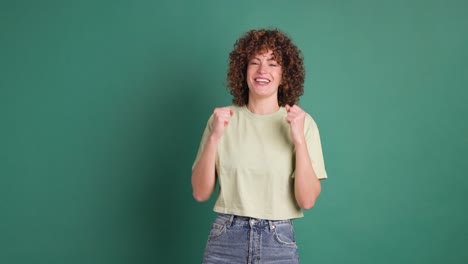 excited young woman clapping hands and smiling