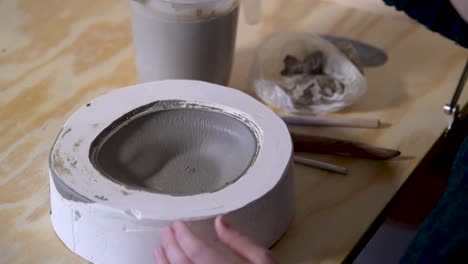 attaching clay cylinder with hole to bowl