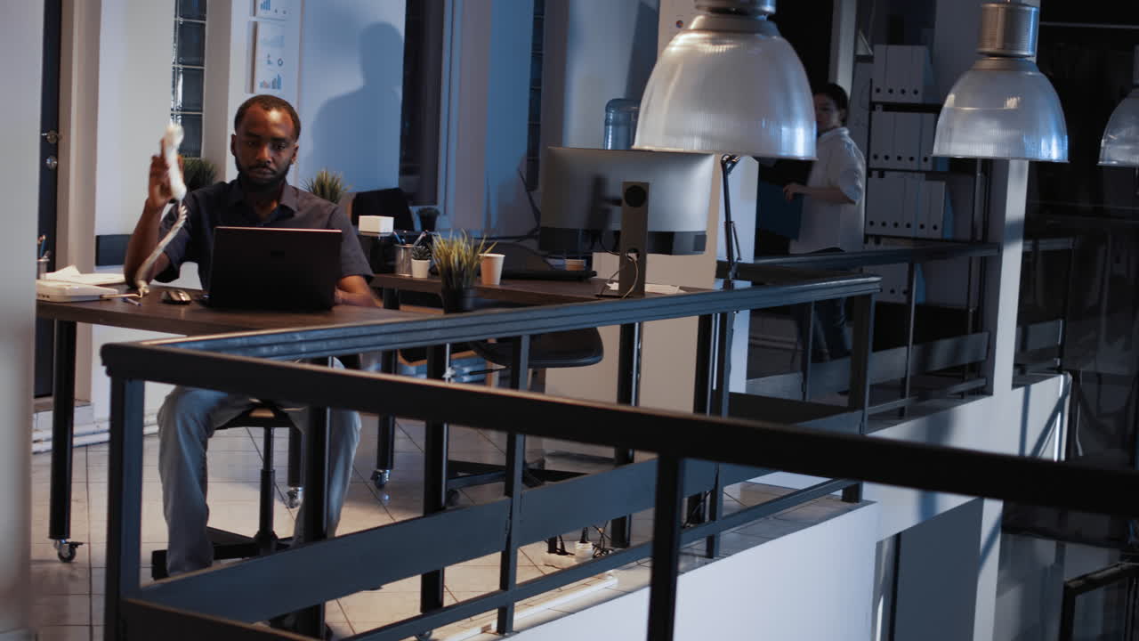 Corporate employee answering landline phone call