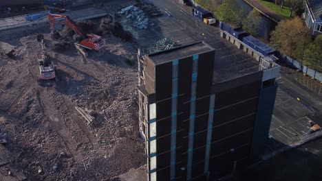Demolished-multi-storey-car-park-concrete-construction-site-debris-in-town-regeneration-aerial-view-demolition