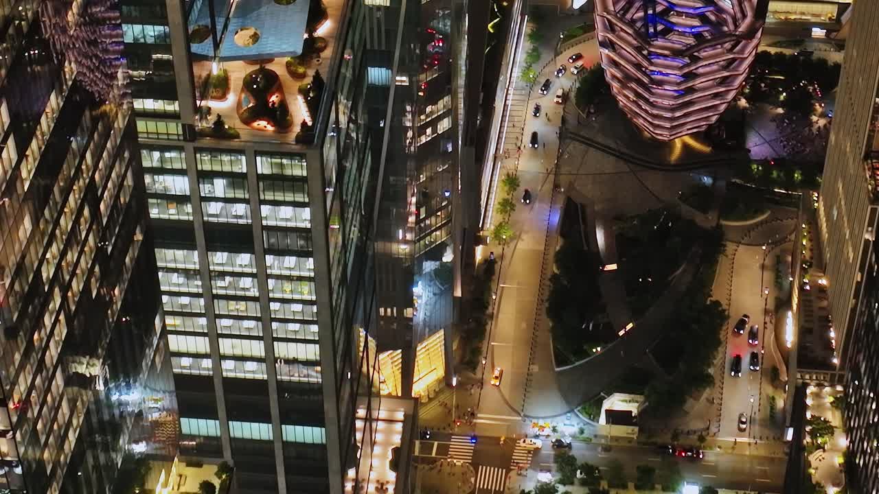 Aerial view of bustling streets and buildings in New York City at night