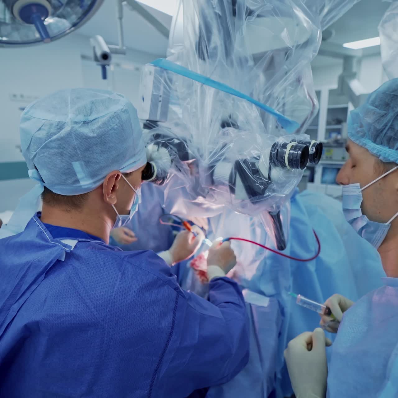 Group of neurosurgeons. Professional doctors in blue medical uniform conduct a neurosurgery using microscope in modern clinic.