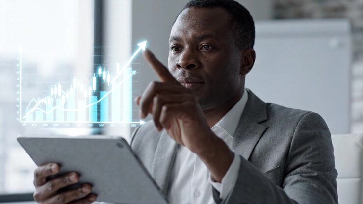 Focused Business Professional Analyzing Growth Charts on Tablet in Modern Office Setting, Representing Data Analysis and Strategic Decision-Making Process.