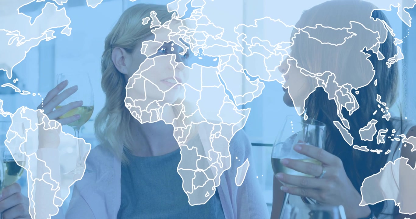 Two women conversing in lounge, gesturing glasses and initiating world map overlay in business talk