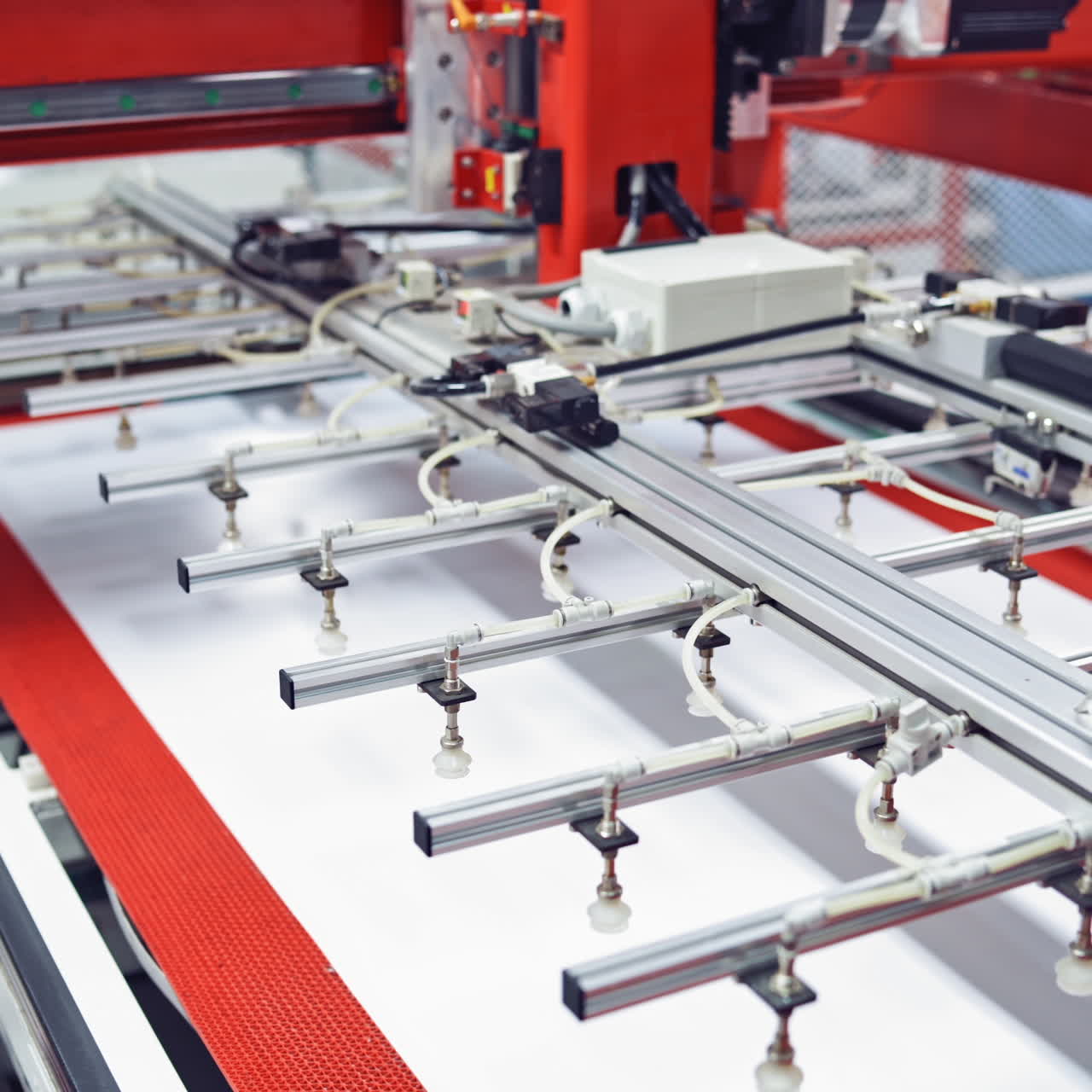Modern manufacturing equipment inside the plant. Automated technologies in the factory indoors. Camera moves slowly.