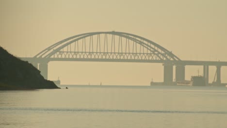bridge over the water on a foggy day