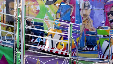 passengers enjoying a colorful amusement park ride