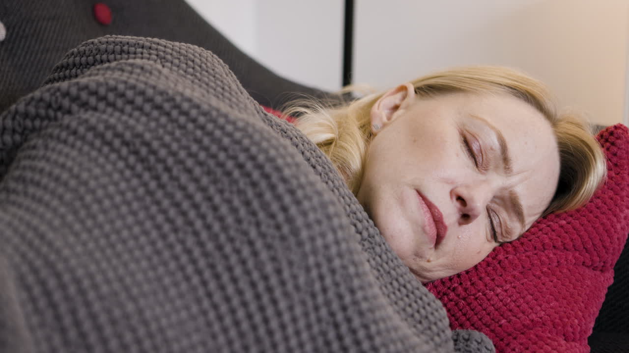 Woman sleeping on couch