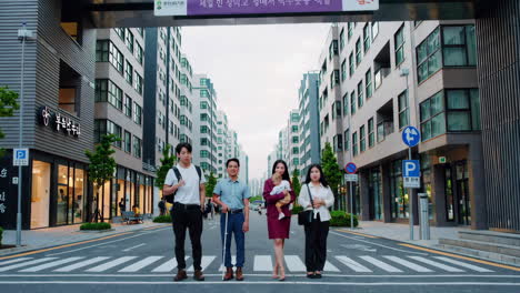 diverse group crossing urban street