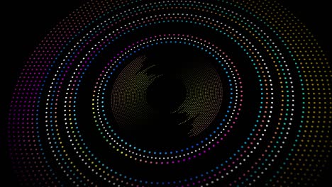 circles of colored dots on black background in 4k video.