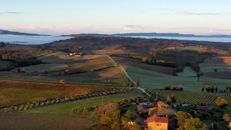 tuscany, italy, aerial footage of nature landscape beautiful hills forests fields and vineyards during sunrise