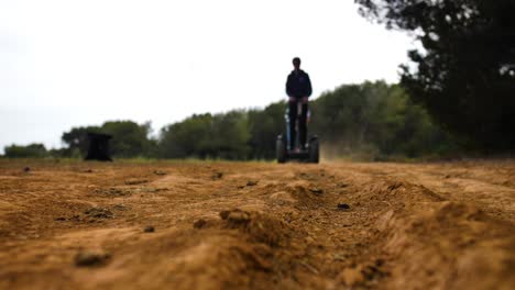 Tourists-riding-a-Segway-scooter-through-forest-and-fields-in-Spain