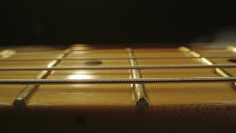 close-up of a guitar fretboard