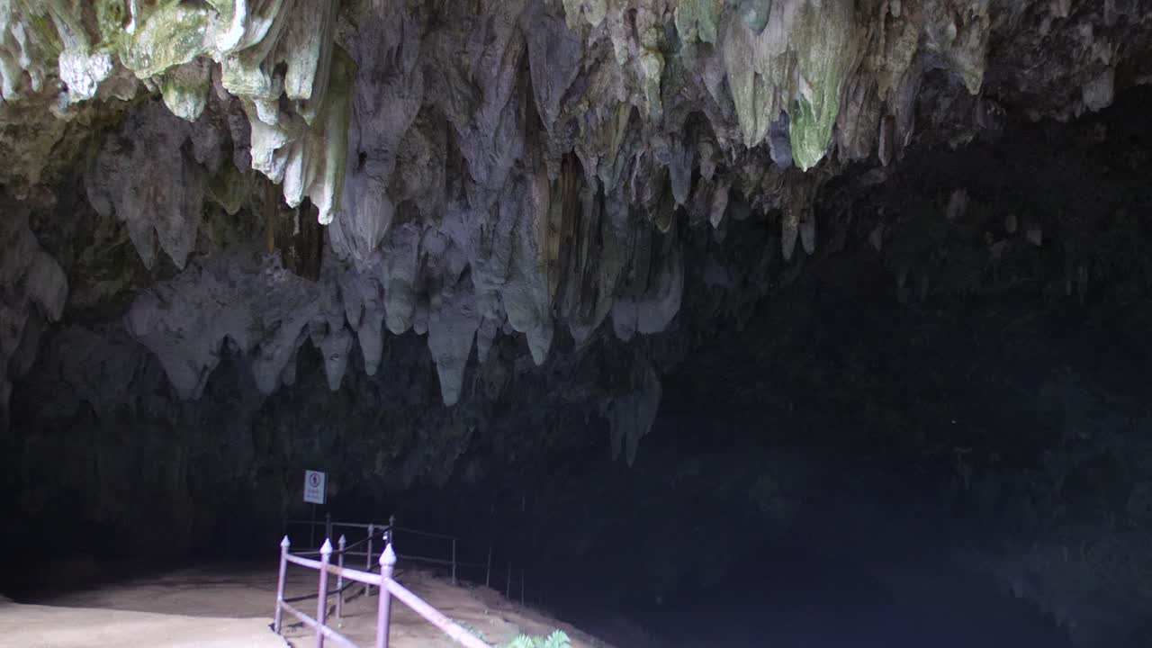 Exploring a Cave with Stalactites