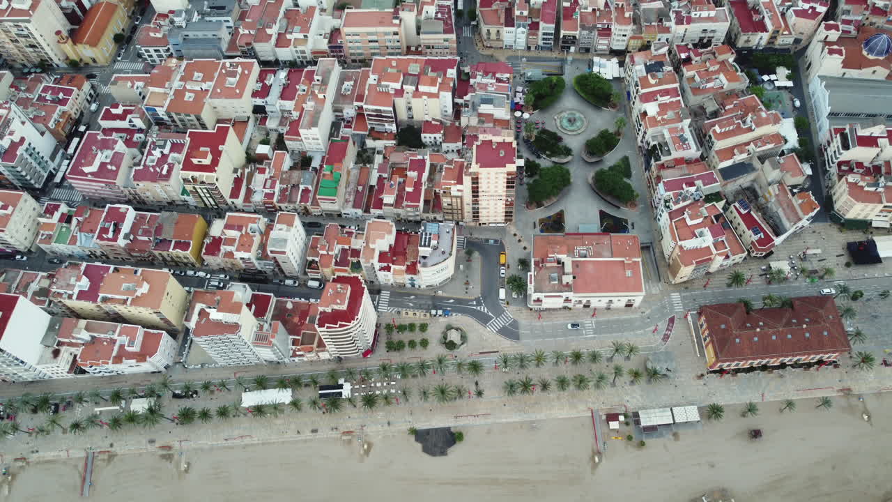 Aerial view of a coastal city with a beach