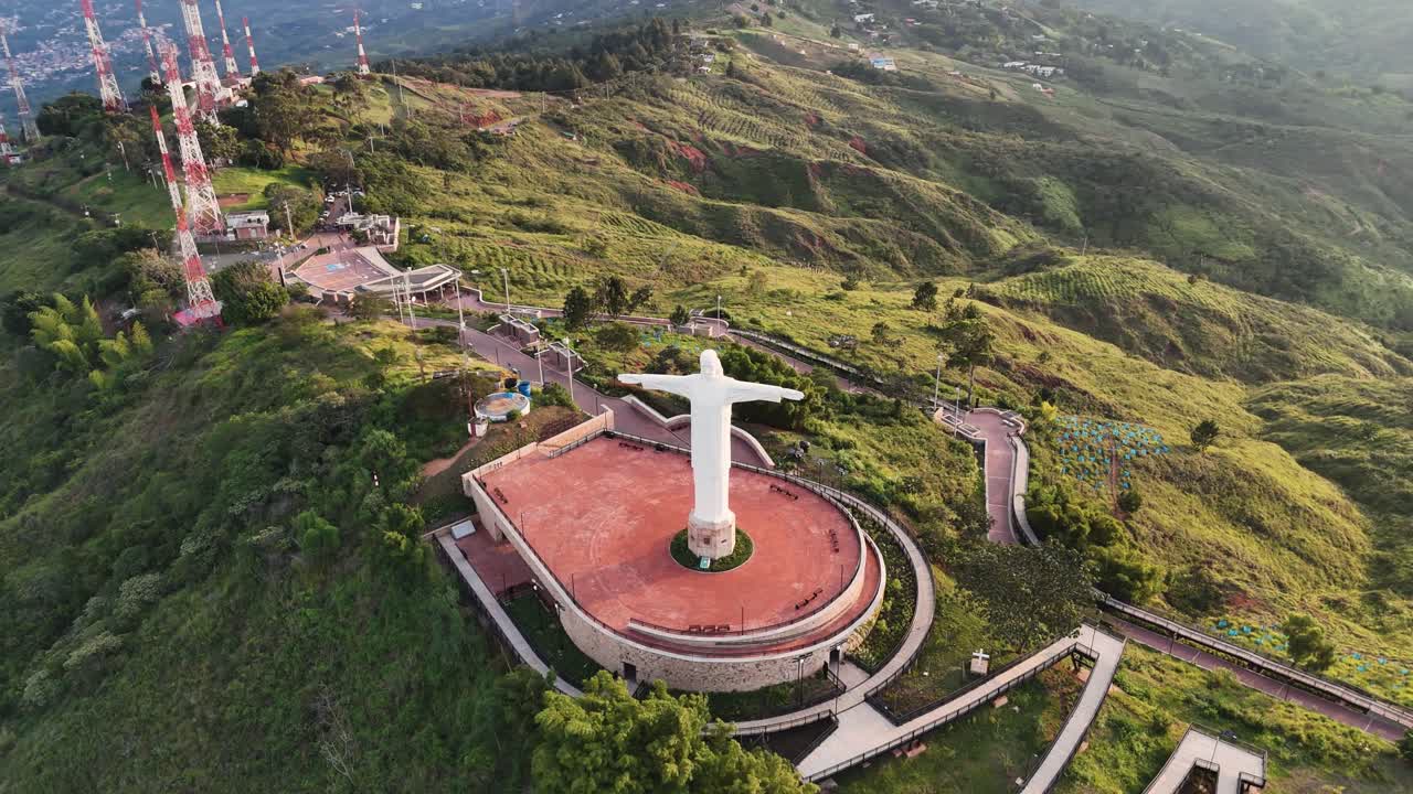 Aerial View of the Cristo Rey Statue and Surrounding Hills in Cali, Colombia