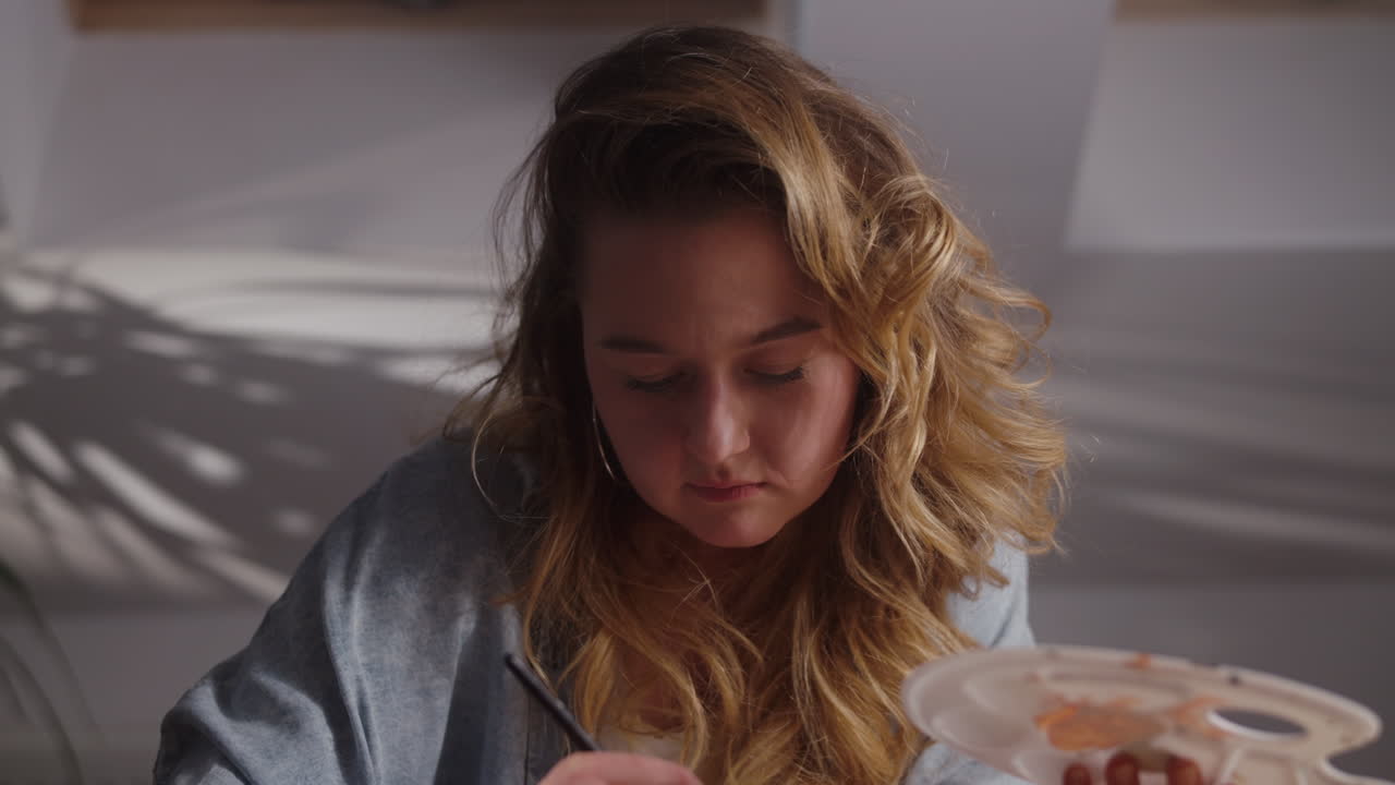 Woman Artist Drawing in Studio