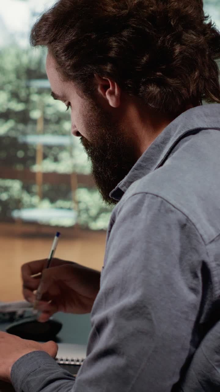 Vertical Video Financial advisor opening laptop to check revenue updates