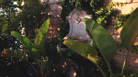 water fountain, pan shot, on a patio, in los angeles, california, usa