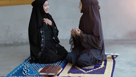 asian muslim woman praying and prostrating at home