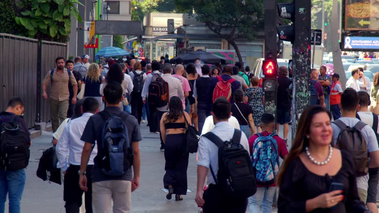 Busy City Street with People Walking and Crossing
