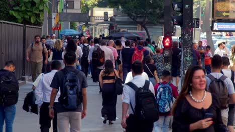 busy city street with people walking and crossing