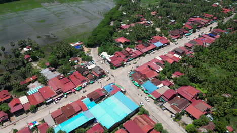 local village crossroad in rural cambodia with light traffic