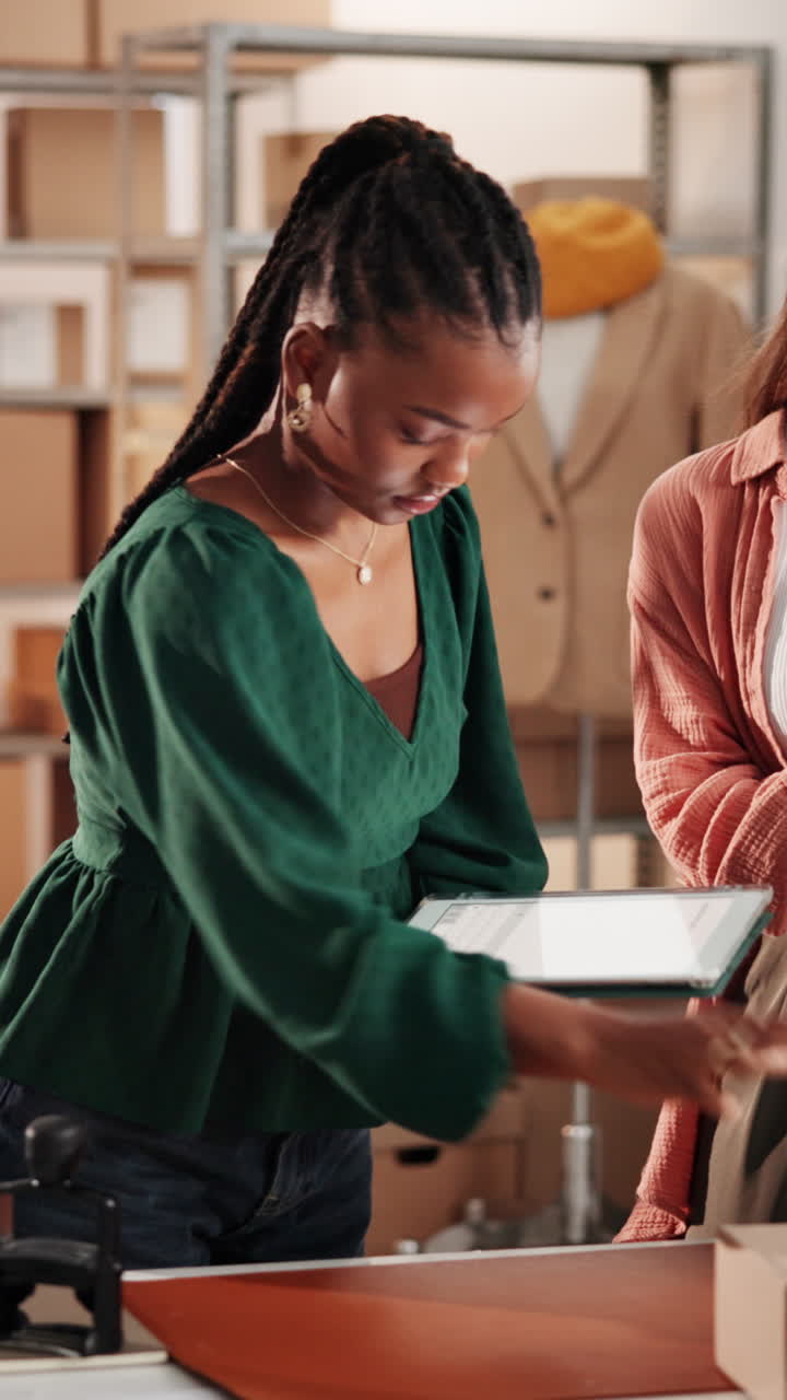 Two Women Working in E-commerce Warehouse, Scanning and Packing Orders