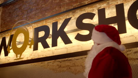 santa man walking upstairs in sport club. confident sportsman entering at gym