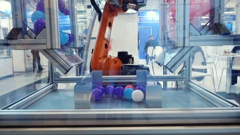 industrial robot handling colored balls