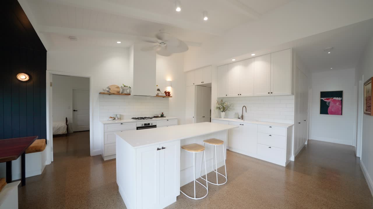 Rustic barn style home with open kitchen and living area, wooden accents, and warm lighting