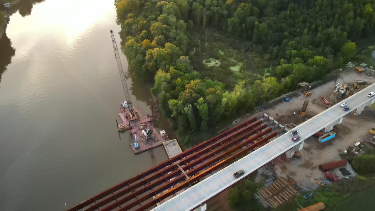 Floating Construction Barge With Crane On Cumberland River. Construction Of McClure Bridge In Clarksville, Tennessee. aerial orbit