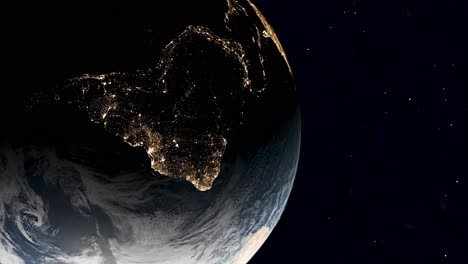 earth at night from space with city lights showing activity in south america