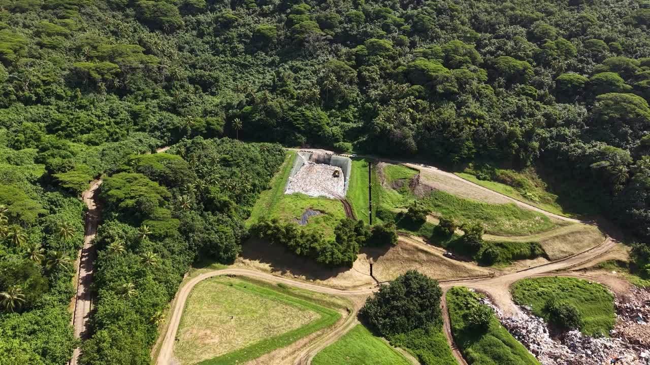Aerial View of Landfill Amidst Lush Vegetation