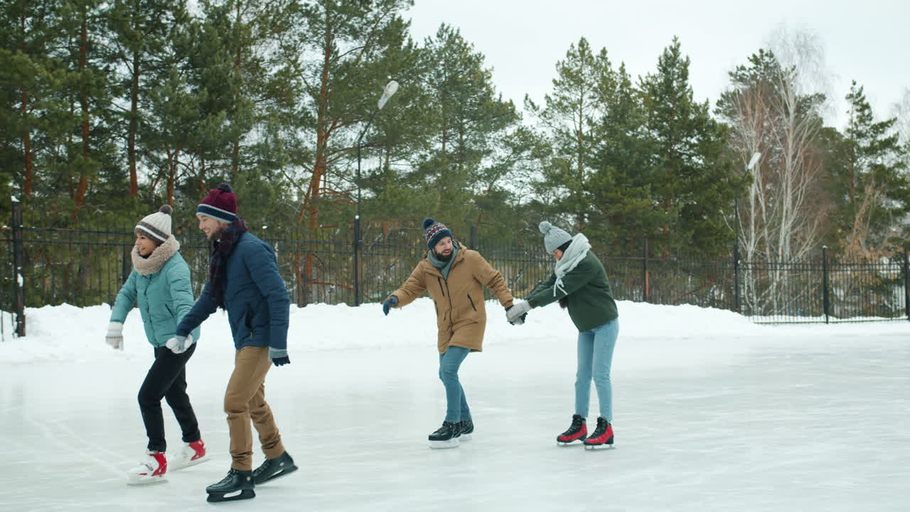 Friends Ice Skating in Winter Park