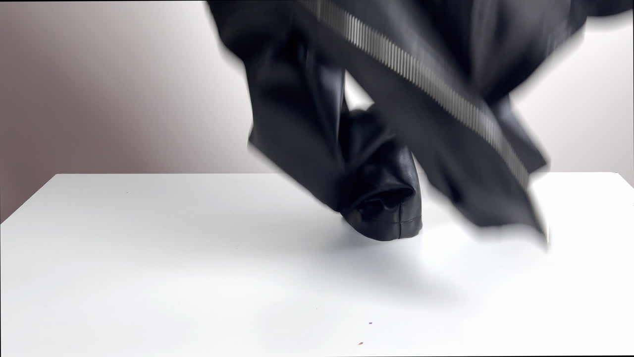 Black Leather Jacket Falling onto White Surface | Premium Stock Video ...