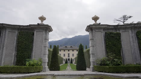formal garden entrance with villa in background
