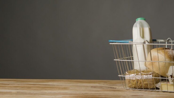 Studio Shot Of Basic Food Items In Supermarket Wire Shopping Basket 6