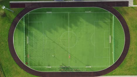 soccer field with green grass. aerial top view from drone