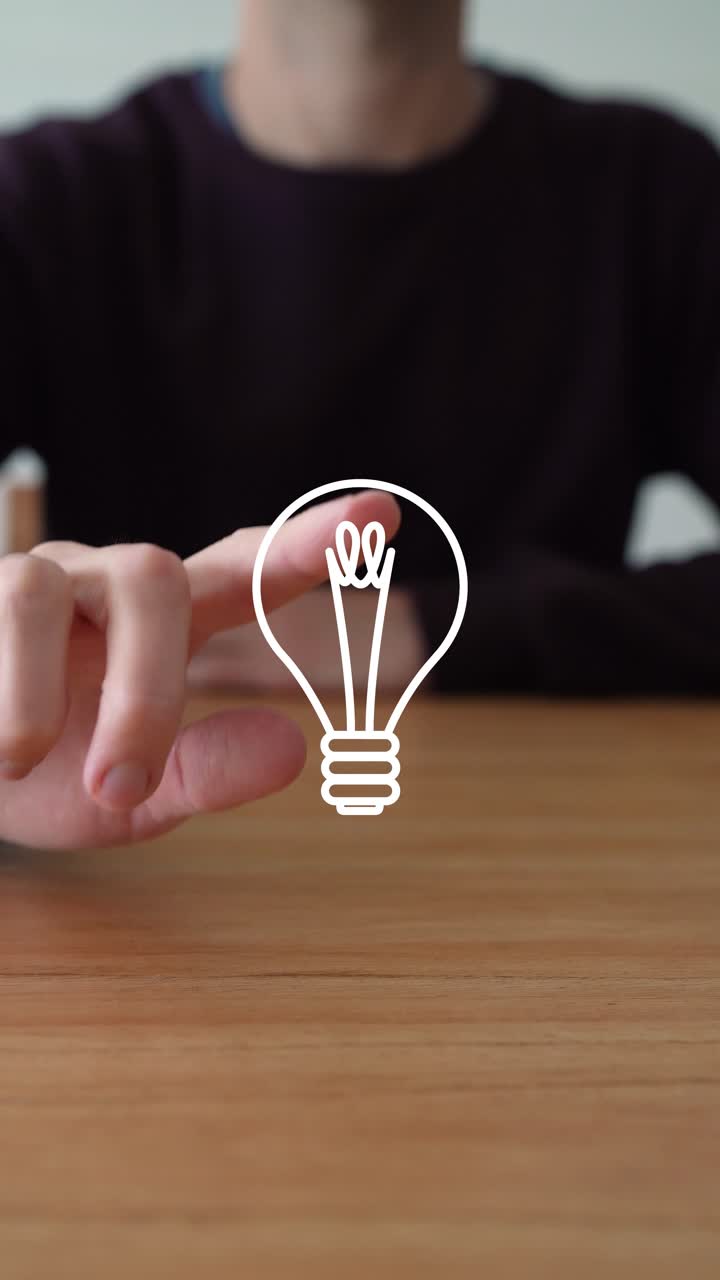 Person's Finger Touch The Light Bulb, New Ideas And Creativity Symbol. - closeup shot