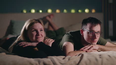 couple relaxing in bed