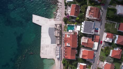 top down aerial view, beach, promenade and beachfront houses by adriatic sea, herceg novi, montenegro