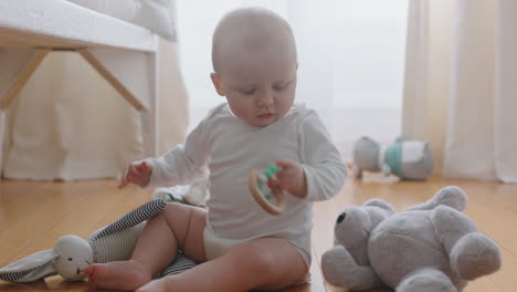 cute little baby boy playing with toys at home happy toddler learning having fun enjoying childhood