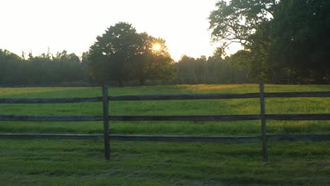 trucking shot of a fence at sunset near the joseph smith family farm, frame house, temple, visitors center, sacred grove in palmyra new york origin locations for the mormons and the book of mormon