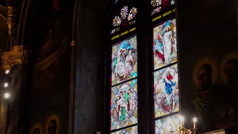 interior view of colored stained glass windows inside big eclectic cathedral