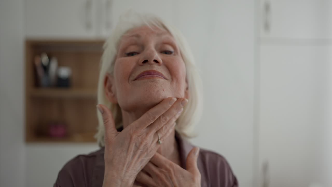 Senior woman taking care of her skin